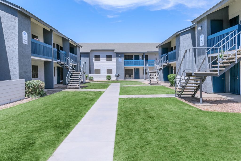 Apartment complex exterior pathway and grass