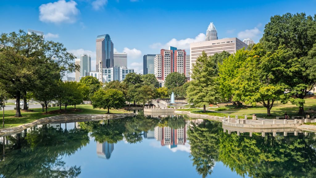 The Skyline of Charlotte is reflecting on the Water in Marshall Park